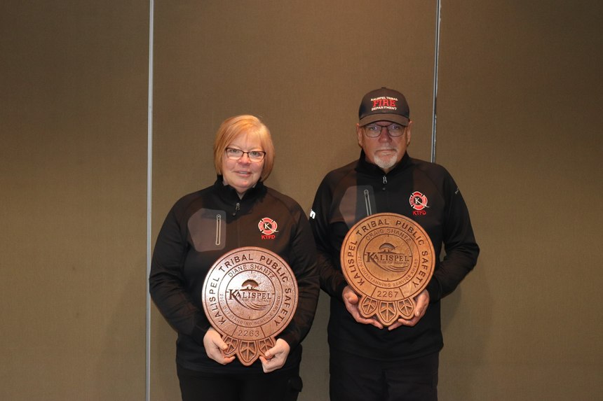 Dianne (left) and Craig Shantz accept Outstanding Service Awards from the Kalispel Tribe Fire Department.