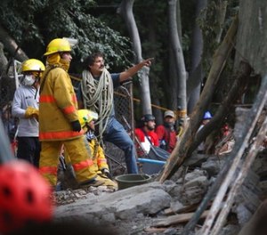 First responders work on removing the rubble of a collapsed building looking for survivors trapped underneath, after a 7.1 earthquake in Mexico City, Tuesday, Sept. 19, 2017. The earthquake stunned central Mexico, killing more than 100 people as buildings collapsed in plumes of dust. (AP Photo/Gustavo Martinez Contreras)