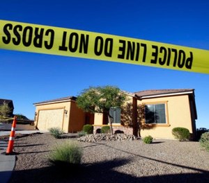 This Oct. 2, 2017 file photo shows police tape blocking off the home of Stephen Craig Paddock in Mesquite, Nev. (AP Photo/Chris Carlson, File)