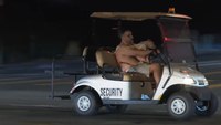 Watch: Shirtless suspect in stolen golf cart with dog on his lap leads LAPD on slow-speed pursuit
