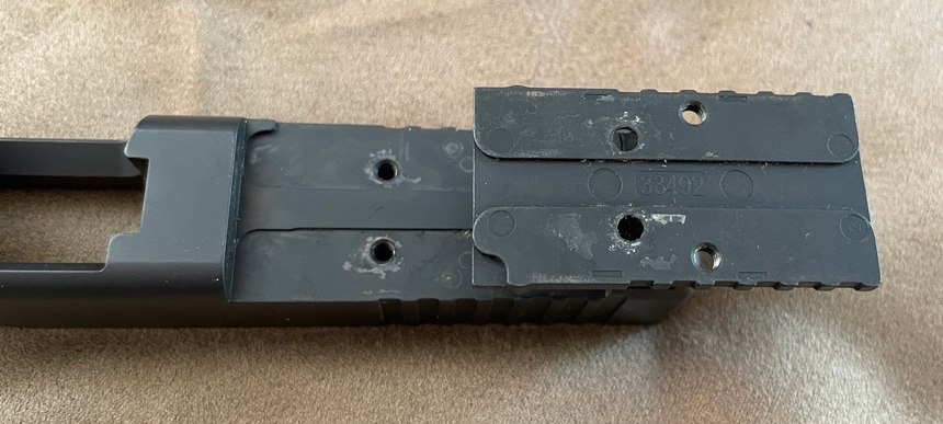 Figure 2: Close up of Glock MOS slide and upside-down plate. Note the extensive machining to take the stress when the pistol is fired.