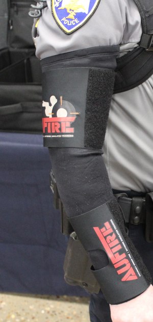 AUFIRE is a sleeve system that uses electrical muscle stimulation (e-stim) to simulate an incapacitating injury.