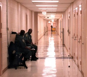 COs keep watch in a hallway on the second floor of the Mecklenburg County Jail in Charlotte, North Carolina. Kyle Harris had served as a detention officer with the facility since August 2017.
