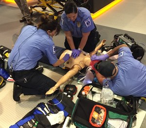 EMS personnel complete a hands-on training simulation on a protocol update.