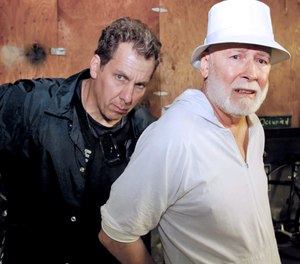 FBI agent Scott Garriola cuffing Whitey Bulger. On Thursday, Fotios Geas, also known as “Freddy,” age 55, Paul J. DeCologero, also known as “Pauly,” 48, and Sean McKinnon, 36, were charged on Wednesday with conspiracy to commit first degree murder for the beating death of Bulger in 2018. (Courtesy of William Morrow)