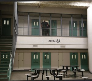Sheriff deputies check on an inmate returning from his court appearance. Additional safety measure were added to the San Diego Central Jail to prevent inmates from attempting suicide by jumping off the second level of the Enhance observation unit.