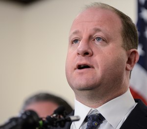 Colorado Gov. Jared Polis speaks to the media on May 8, 2019, in Highlands Ranch, Colorado.