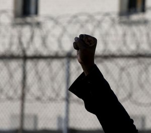 People rally outside the Cook County Jail.