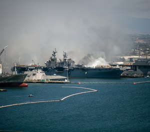 Emergency crews responded to the scene of a fire aboard the USS Bonhomme Richard on Sunday, July 12, 2020 in San Diego, Calif. The ship will be decommissioned within a year and will be scrapped, a Navy official told reporters during a conference call Monday.