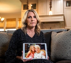 Cheryl Pangburn holds a photo of her and her mother, Marilyn Bixler taken at luxury senior living community Parkview in Frisco at Pangburn's home in Frisco. Pangburn learned via social media that her mother may have been the victim of a serial killer.