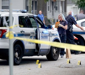 Newport News police investigate a scene at the Cottage Grove Apartments in the aftermath of a shooting on Aug. 17, 2019.