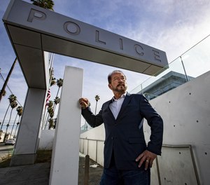 Chang Lee, 63, stands for portrait in front of the LAPD Olympic Station on Thursday, Jan. 7, 2021 in Los Angeles, CA.