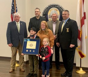 Ethan Walker, 9, was honored by lawmen Monday, Jan. 25, 2021 after pulling his sister to safety during an armed carjacking earlier this month.
