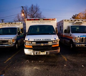 A judge has reinstated the licenses of two EMTs accused of striking a patient in the back of an ambulance in Jersey City, citing a