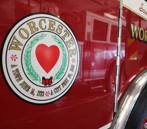 A man is accused of setting a car on fire and trying to stop Worcester firefighters from extinguishing the flames.