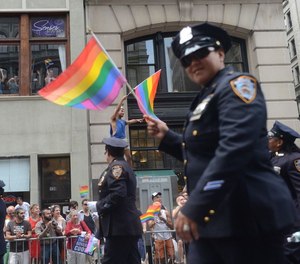 An NYPD officer gets into the spirit at the Gay Pride Parade on June 30, 2013.