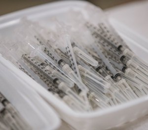 Vaccine shots are prepared at a vaccination event at the Las Cruces Convention Center in Las Cruces on Wednesday, June 16, 2021.