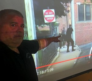 Springfield police firearms training officer Michael Dumas points to what he considers the most dangerous part of the June 20 pursuit. Both the suspect and officer are standing less than 50 feet apart, and each have their guns drawn. Dumas said if he were there, he would have opened fire in self defense.