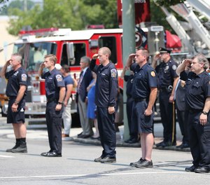 Hundreds of uniformed firefighters flanked the road where services were held for Sean DeMuynck, the volunteer firefighter who died in the line of duty the day before he was set to return home to Canada.