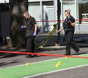 Police investigate an overnight shooting in downtown Portland on Saturday, July 17, 2021.