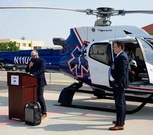 Clint Burleson, regional air manager of Native Air, addresses community members and employees of Carlsbad Medical Center during a ceremony July 22, 2021. Nick Arledge, chief executive officer of Carlsbad Medical Center looks on.