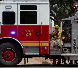 Firefighters practice tactics to manage and steer away fire as they participate in training Tuesday in West Austin.