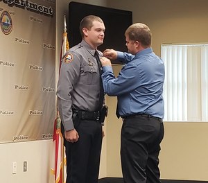 This 2019 photo shows Jason Raynor being sworn in as a Daytona Beach police officer.