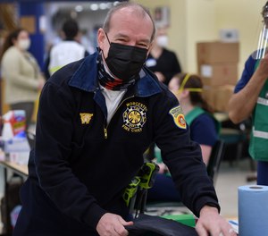 Fire Chief Michael J. Lavoie at a vaccination center.