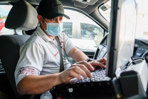 TransCare field operations supervisor Spencer Wynn monitors active ambulance calls and the state of local hospitals in Tampa.