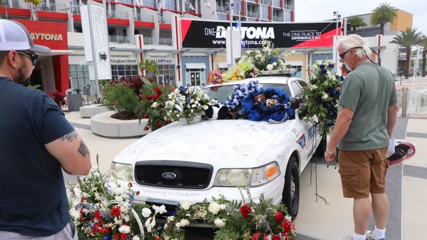 Slain Daytona officer's patrol car signed with messages of honor