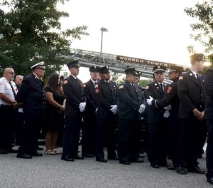 Firefighters from RI and neighboring Massachusetts march in procession to the the Smith Funeral &Memorial Service in Warren for Brian Remy, the Assistant Chief of the Warren Fire Department who was gunned down in Warren last week.