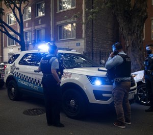 Chicago police officers work in the Rogers Park neighborhood of Chicago on Sept. 7.