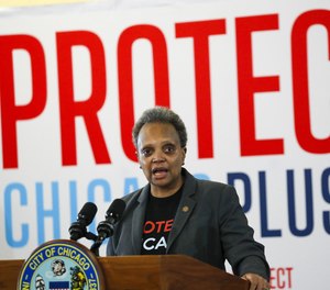 Mayor Lori Lightfoot answers questions at a COVID-19 vaccination site in Chicago on Feb. 19, 2021.