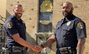 Birmingham police Officers Anthony Evans (left) and Michael Burnett recount their dramatic flood rescue of an unresponsive 87-year old woman.