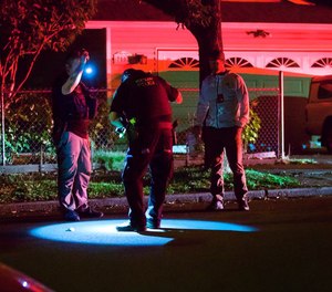 Portland police officers respond to a shooting between two vehicles Sept. 29 near Southeast 74th Avenue and Harold Street.