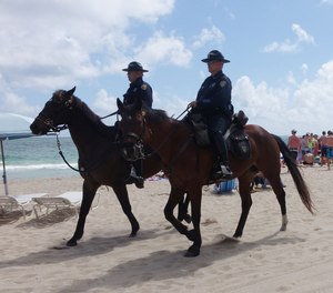 Fort Lauderdale police patrol the beach by horseback during spring break in March 2015. The department’s mounted patrol unit is made up of one sergeant, six officers and nine horses.