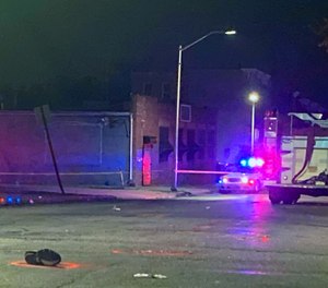The man’s body remained on the street under a white sheet, and one of his shoes was in the intersection marking the spot of impact.