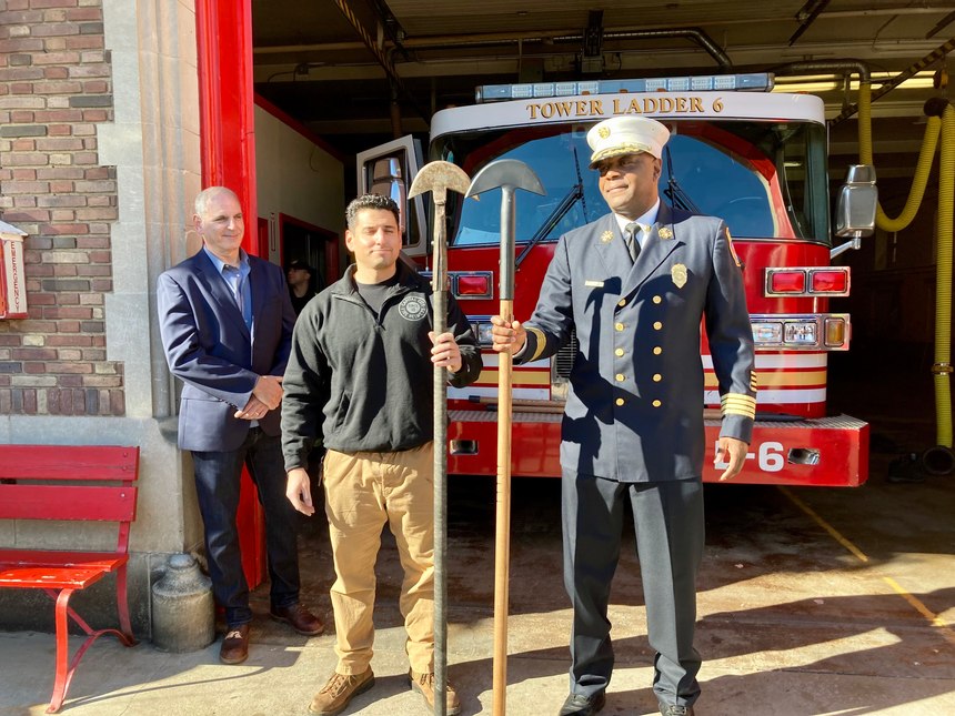 From left, retired Hartford deputy fire chief Leigh Shapiro and firefighter Ashley Shapiro, his son, stand with Hartford Fire Chief Rodney Barco outside the South Green fire station on Monday, Nov. 8. Barco holds a modern Hartford hook produced by the Shapiros' company, Capital City Fire Helmet, while Ashley Shapiro holds a hook with an original head, made as many as 80 years ago by fire department machinists.