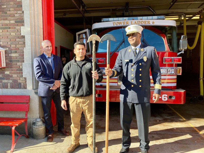 From left, retired Hartford deputy fire chief Leigh Shapiro and firefighter Ashley Shapiro, his son, stand with Hartford Fire Chief Rodney Barco outside the South Green fire station on Monday, Nov. 8. Barco holds a modern Hartford hook produced by the Shapiros' company, Capital City Fire Helmet, while Ashley Shapiro holds a hook with an original head, made as many as 80 years ago by fire department machinists.