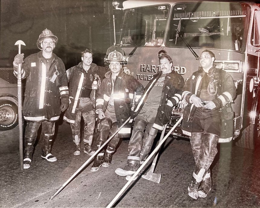 A photo from the 1980s, now hanging in Engine Company 1, shows Leigh Shapiro standing with the half-moon hook in hand.