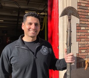 Ashley Shapiro holds an original Hartford hook head that he bolted to a new handle.