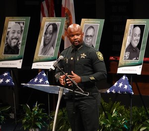 Broward Sheriff Gregory Tony speaks at a memorial service on Tuesday for nine BSO employees who died from COVID-19.