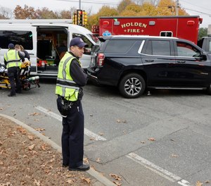 A fire department ambulance transporting a patient to the hospital was involved in a three-vehicle crash Wednesday morning.
