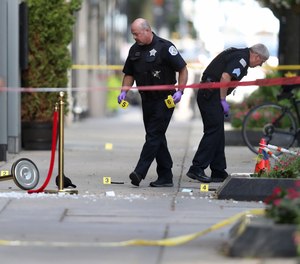 Chicago police investigate a shooting at first block of East Oak Street in the Gold Coast neighborhood on Aug. 4, 2020.