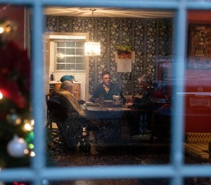 Rene White, center, spends Thanksgiving with his brother Barry White, right, their mother Grace White, far left, and her caretaker Virginia Dean at Grace's condominium in Memphis, Tenn. The Cook County sheriff's office helped reunite the family after Barry White was found homeless in a tollway oasis in Chicago.