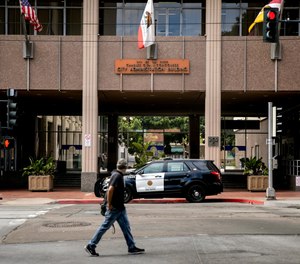A San Diego Police Department vehicle is parked outside of San Diego City Hall on June 23, 2020 in San Diego, California.
