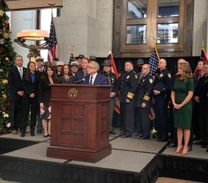 Gov. Mike DeWine speaks Monday in the Ohio Statehouse atrium about a proposal to use 50 million in federal coronavirus relief money to provide grants to police and other first-responders, as well as fund efforts to improve their wellness.