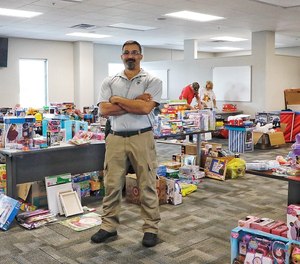 Port Orange police officer Wayne Jean lead the Cops for Christmas initiative for the second time in 2021.