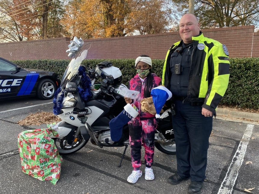 Gastonia (N.C.) Police Officer Josh Lefevers participates in buying gifts for the fifth-graders of the Boys and Girls Clubs of Gaston for Shop with a Cop.