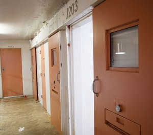 A cell door stands open in a housing pod where many inmates with mental illness are kept at the Hampton Roads Regional Jail in Portsmouth, seen in 2018.